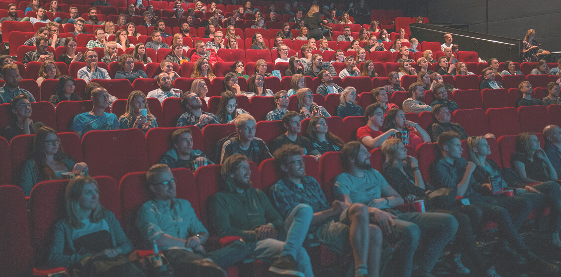 People watching a movie in a theater